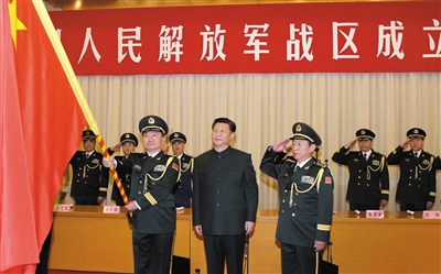 习近平将军旗授予南部战区司令员王教成、政治委员魏亮。