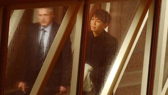 2014年7月李伟在阿德莱德机场被警方带走